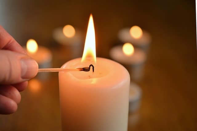 natural candle being lit with a match