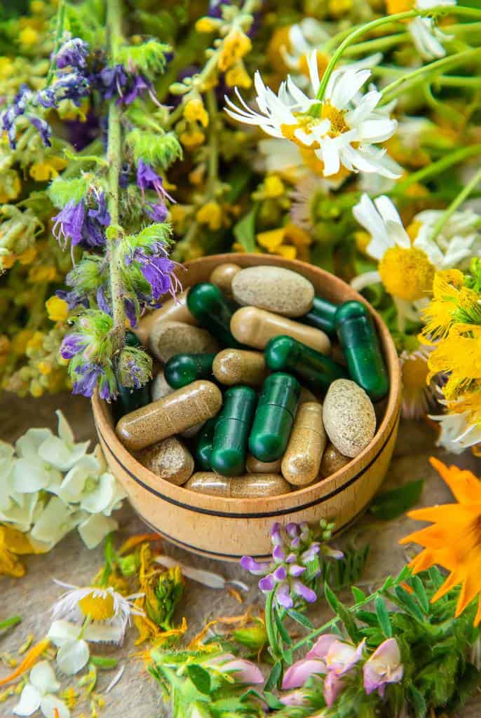 supplements laying in flowers